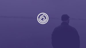 Header - Michael King In coat walking towards water